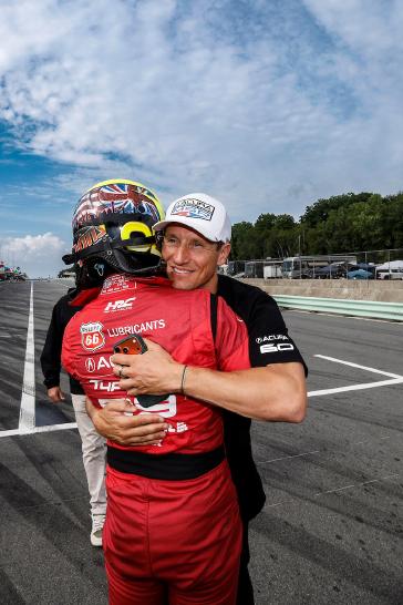 Pole Award winner #93: Acura Meyer Shank Racing w/Curb Agajanian, Acura ARX-06, GTP: Nick Yelloly celebrates with teammate Renger van der Zande