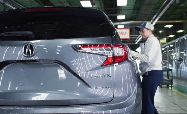 A Honda associate at the East Liberty Auto Plant checks the fit and finish of the 2026 Acura RDX, which was the 16th-best vehicle in this year’s Cars.com American-Made Index