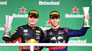 Max Verstappen (left) and Pierre Gasly (right) display their trophies after finishing first and second in Sunday’s Brazilian Grand Prix