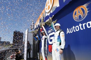 #10: Alex Palou, Chip Ganassi Racing Honda, #27: Kyle Kirkwood, Andretti Global Honda, #15: Graham Rahal, Rahal Letterman Lanigan Racing Honda celebrate on the podium