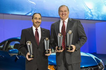 Larry Dominique, President of ALG presents multiple ALG 2014 Residual Value Awards to John Mendel, Executive.Vice President of Sales at American Honda Motor Co., Inc. at the 2013 Los Angeles Auto Show, November 20, 2013