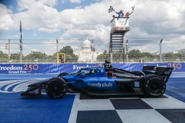 US Secretary of Transportation Sean Duffy and wife Rachel Campos-Duffy wave the checkered flags for #27: Kyle Kirkwood, Andretti Global Honda