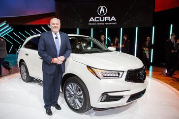 John Mendel, executive vice president of American Honda Motor Co., Inc., with the 2017 Acura MDX at the 2016 New York International Auto Show on March 23, 2016.