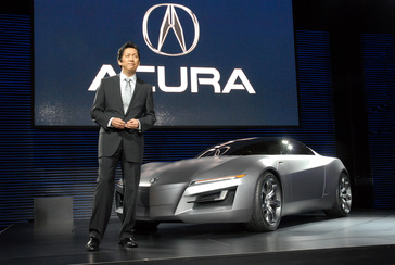 Detroit - January 7, 2007 -- Jon Ikeda, principal designer, Acura Design Center unveils the Acura "Advanced Sports Car Concept" today at the 2007 North American International Auto Show in Detroit.  The concept's exterior demonstrates a dynamic fusion of advanced technology and emotion.  The long, pronounced hood features deeply sculpted lines and embossed air vents, both of which hint at the powerful engine beneath.  The exterior lines run the length of the body, creating a ribbon-like effect from the front headlights to the rear wheel arches, evoking a feeling of movement and power.  For more information go to www.acuranews.com.