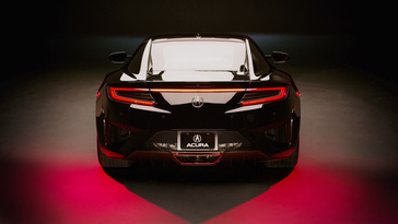 Custom MusiCares NSX with red accents on the lower diffuser and smoke tinted taillights