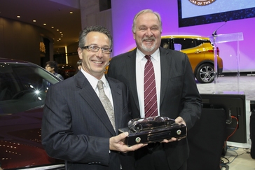 2017 Honda Ridgeline Development Engineer Jim Loftus (left) and John Mendel, executive vice president of the Automobile Division of American Honda Motor Co., Inc., display the North American Truck of the Year award received for the 2017 Honda Ridgeline on January 9, 2017 at the North American International Auto Show in Detroit.