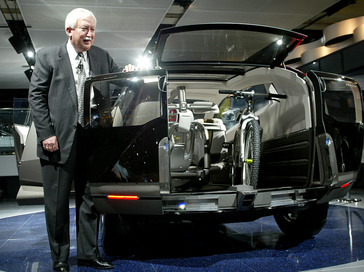 Tom Elliott, executive vice president of American Honda, with the Acura RD-X SUV concept.  The RD-X features sliding rear doors and folding rear seats for maximum utility, including the ability to carry two mountains bikes.  Power comes from a 250-horsepower gas-electric hybrid powertrain with four-wheel drive.