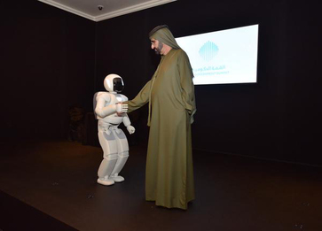 ASIMO shakes hands with His Highness Sheikh Mohammed Bin Rachid Al Maktoum UAE Vice President, Prime Minister and Ruler of Dubai at a government summit in Dubai.