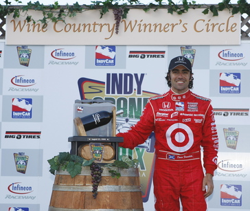 22-23 August, 2009, Sonoma, California USA. Dario Franchitti poses with his latest trophy. ©2009, Phillip Abbott, USA. LAT Photographic.