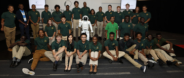 STEM Students from Columbus Northland High School have their picture taken with ASIMO