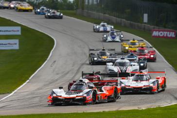 Helio Castroneves found traction with his Acura ARX-05 where others could not, as he and his Acura Team Penske co-driver Ricky Taylor prevailed in monsoon-like conditions in the final hour to win Sunday’s IMSA WeatherTech SportsCar Championship race at Road America.