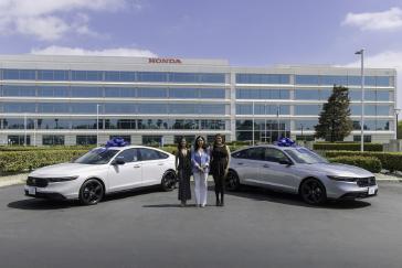 Sisters Andrea (left) and Alondra (right) flank American Honda Assistant VP of Sales Jessika Laudermilk, with the sister's 2026 Honda Accords on each side.