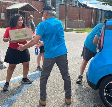Honda associates aid the Lincoln Food Pantry’s mobile distribution event on August 26 in Lincoln, Alabama. The pantry is conducting mobile distributions while planning the rebuild of its facility, which burned down earlier in the year.