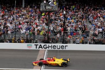 Alex Palou #10 of Chip Ganassi Racing Honda take the checkered flag