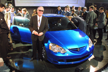 ACURA RS-X PROTOTYPE WORLD DEBUT -- DETROIT -- January 8, 2001 - Acura Executive Vice President Dick Colliver wears 3-D glasses for the world debut reveal of the Acura RS-X prototype during the North American International show today. The RS-X prototype offers a first glimpse of the technology and styling direction for an all-new Acura production vehicle that will be introduced later this year.