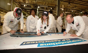 Associates sign a banner during a celebration marking the start of mass production for the new-model 2013 Acura RDX luxury sport-utility vehicle at Honda's auto plant in East Liberty, Ohio.